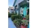 House entrance with teal accents and lush landscaping at 1281 Nebraska Ln, North Port, FL 34286
