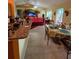 Open concept kitchen and dining area with tile flooring and breakfast bar at 1281 Nebraska Ln, North Port, FL 34286