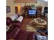 Comfortable living room with leather sofas and a large TV at 1281 Nebraska Ln, North Port, FL 34286