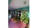 Peaceful covered patio with lush tropical plants and pink floor at 1281 Nebraska Ln, North Port, FL 34286