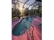 Screened-in pool area with pink deck and lounge chairs at 1281 Nebraska Ln, North Port, FL 34286