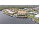 High-angle view of waterfront property with boat docks and pool at 1340 Rock Dove Ct # 135, Punta Gorda, FL 33950