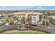 Aerial view of building, highlighting its waterfront location and landscaping at 1340 Rock Dove Ct # 135, Punta Gorda, FL 33950
