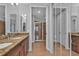 Double vanity bathroom with granite countertop and a large shower at 1340 Rock Dove Ct # 135, Punta Gorda, FL 33950