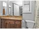 Bathroom with granite countertop, wood cabinets, and tiled floors at 1340 Rock Dove Ct # 135, Punta Gorda, FL 33950