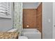 Bathroom with tub shower, tile surround, and granite vanity at 1340 Rock Dove Ct # 135, Punta Gorda, FL 33950