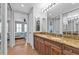 Elegant bathroom with double vanity and a view of the bedroom at 1340 Rock Dove Ct # 135, Punta Gorda, FL 33950
