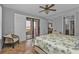 King sized bedroom with balcony access and a sitting area at 1340 Rock Dove Ct # 135, Punta Gorda, FL 33950