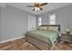 King sized bedroom with tile floors and ceiling fan at 1340 Rock Dove Ct # 135, Punta Gorda, FL 33950