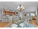 Open concept dining area with chandelier and kitchen view at 1340 Rock Dove Ct # 135, Punta Gorda, FL 33950
