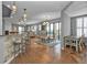 Open concept dining area with glass table and access to balcony at 1340 Rock Dove Ct # 135, Punta Gorda, FL 33950
