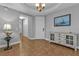 Bright entryway with tile flooring, built-in shelving, and access to bathroom at 1340 Rock Dove Ct # 135, Punta Gorda, FL 33950