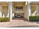 Building entrance with a charming courtyard and benches at 1340 Rock Dove Ct # 135, Punta Gorda, FL 33950