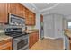Modern kitchen with stainless steel appliances and wood cabinets at 1340 Rock Dove Ct # 135, Punta Gorda, FL 33950