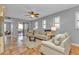 Spacious living room with ceiling fan and access to balcony at 1340 Rock Dove Ct # 135, Punta Gorda, FL 33950