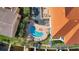 Community pool with surrounding lounge chairs and patio area at 1340 Rock Dove Ct # 135, Punta Gorda, FL 33950