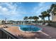 Community pool with lounge chairs and waterfront views at 1340 Rock Dove Ct # 135, Punta Gorda, FL 33950
