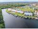 Aerial view of waterfront condos with boat docks and pool at 1348 Rock Dove Ct # C103, Punta Gorda, FL 33950