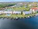 Aerial view of condo building with private boat dock and pool at 1348 Rock Dove Ct # C103, Punta Gorda, FL 33950