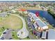 Aerial view of condo building and parking lot near waterfront at 1348 Rock Dove Ct # C103, Punta Gorda, FL 33950