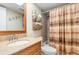 Bathroom with single vanity, tub, and shower at 1348 Rock Dove Ct # C103, Punta Gorda, FL 33950