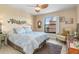 Spacious bedroom with king-size bed and ceiling fan at 1348 Rock Dove Ct # C103, Punta Gorda, FL 33950