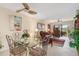 Glass dining table with four chairs in a condo living area at 1348 Rock Dove Ct # C103, Punta Gorda, FL 33950