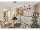 Kitchen features a breakfast bar and a dining area with glass table at 1348 Rock Dove Ct # C103, Punta Gorda, FL 33950