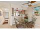 Kitchen features a breakfast bar and a dining area with glass table at 1348 Rock Dove Ct # C103, Punta Gorda, FL 33950