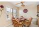 Bright dining area with wicker chairs and glass table at 1348 Rock Dove Ct # C103, Punta Gorda, FL 33950