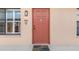 Condo front door entrance with a welcome mat at 1348 Rock Dove Ct # C103, Punta Gorda, FL 33950