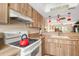Well-equipped kitchen with light wood cabinets and modern appliances at 1348 Rock Dove Ct # C103, Punta Gorda, FL 33950