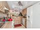 Well-equipped kitchen with light wood cabinets and modern appliances at 1348 Rock Dove Ct # C103, Punta Gorda, FL 33950