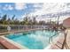 Inviting community pool with brick coping and ample deck space at 1348 Rock Dove Ct # C103, Punta Gorda, FL 33950