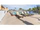 Community pool area with lounge chairs for relaxing at 1348 Rock Dove Ct # C103, Punta Gorda, FL 33950