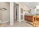Bathroom with double vanity, walk-in shower, and access to walk-in closet at 143 Uruguay Dr, Punta Gorda, FL 33983