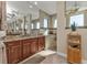 Elegant bathroom with double vanity, walk-in shower, and large mirror at 143 Uruguay Dr, Punta Gorda, FL 33983