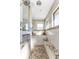 Spa-like bathroom with walk-in shower, granite seat, and large windows at 143 Uruguay Dr, Punta Gorda, FL 33983