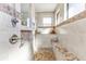 Spa-like bathroom with walk-in shower, granite seat, and large windows at 143 Uruguay Dr, Punta Gorda, FL 33983