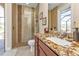 Bathroom with granite countertop and walk-in shower at 143 Uruguay Dr, Punta Gorda, FL 33983