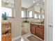 Bathroom with walk-in shower, double vanity and granite countertop at 143 Uruguay Dr, Punta Gorda, FL 33983