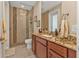 Bathroom with granite countertop and walk-in shower at 143 Uruguay Dr, Punta Gorda, FL 33983