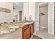 Bathroom with granite vanity, large shower, and separate toilet at 143 Uruguay Dr, Punta Gorda, FL 33983