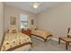 Charming bedroom with twin beds and floral bedding at 143 Uruguay Dr, Punta Gorda, FL 33983