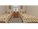 Bright bedroom featuring two twin beds at 143 Uruguay Dr, Punta Gorda, FL 33983