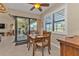 Cozy breakfast nook with a wooden table and chairs, near sliding doors at 143 Uruguay Dr, Punta Gorda, FL 33983