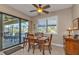 Bright breakfast nook with wooden table and chairs near sliding doors at 143 Uruguay Dr, Punta Gorda, FL 33983