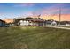 Beautiful home at sunset, showcasing curb appeal at 143 Uruguay Dr, Punta Gorda, FL 33983