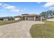 Attractive home with a paved driveway and American flag at 143 Uruguay Dr, Punta Gorda, FL 33983