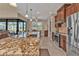 Modern kitchen with island, granite countertops, and stainless steel appliances at 143 Uruguay Dr, Punta Gorda, FL 33983